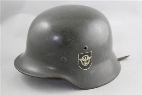 A German Third Reich M40 combat police helmet,